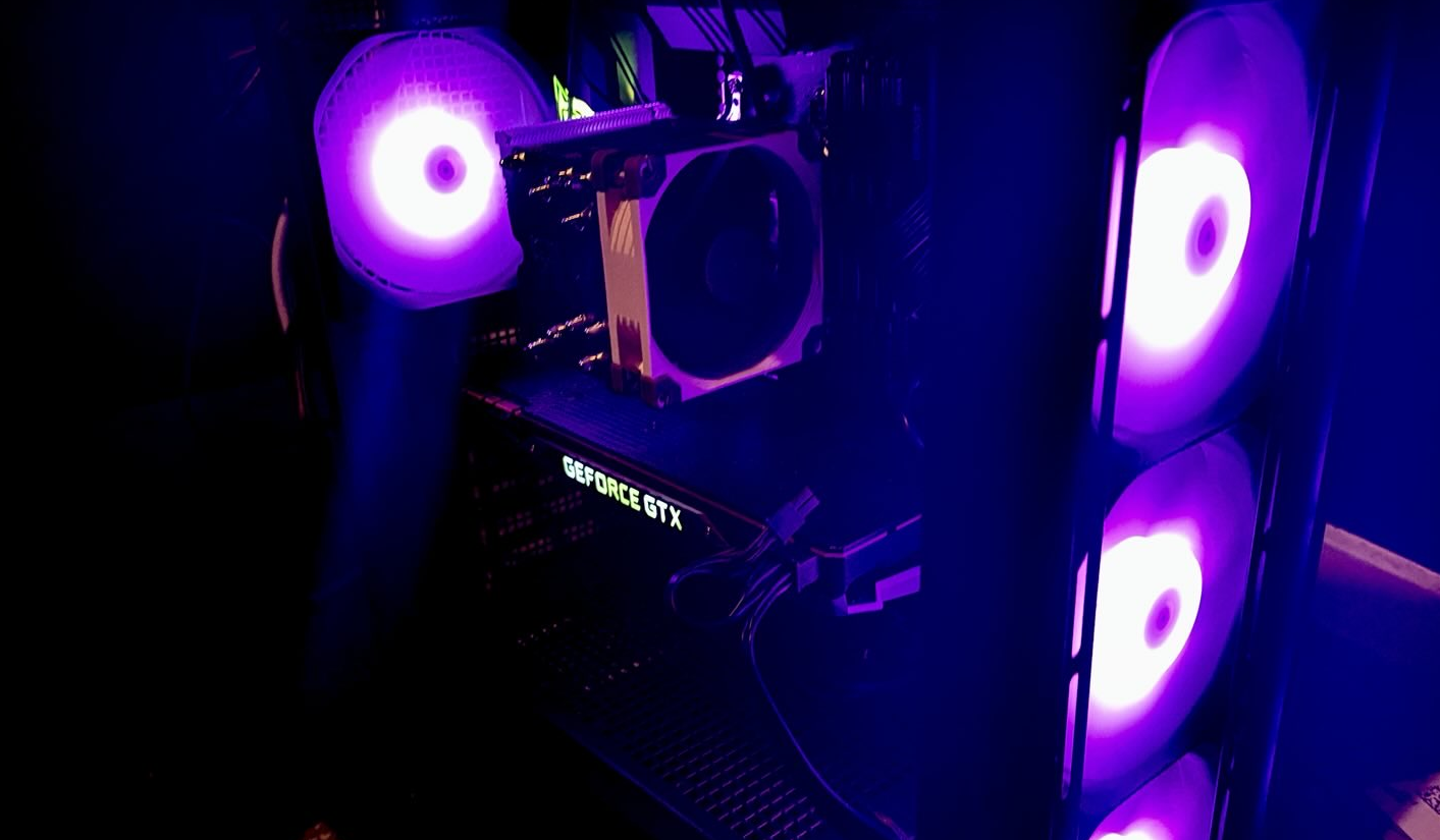 Retro PC hardware glowing in neon light